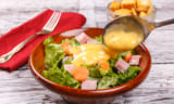 Close up of a delicious salad with honey mustard dressing.