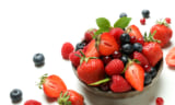 Delicious fresh berry mix on white background