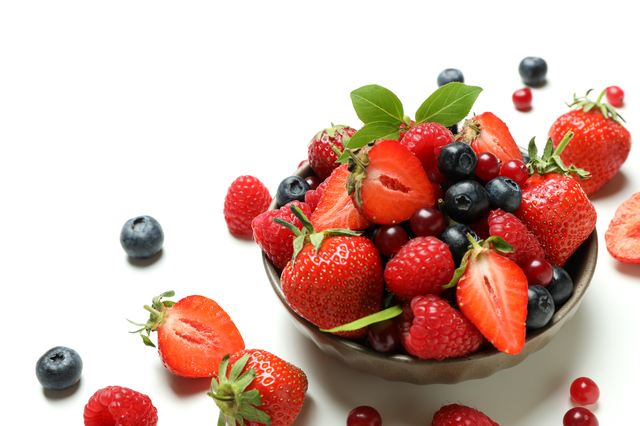 Delicious fresh berry mix on white background